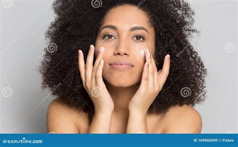 Young African American Woman Applying Professional Skincare Product ...