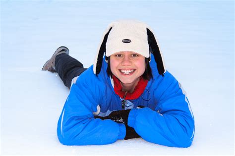 Girl Lying In Snow Free Stock Photo - Public Domain Pictures