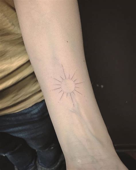 Sun Tattoo On The Inner Forearm