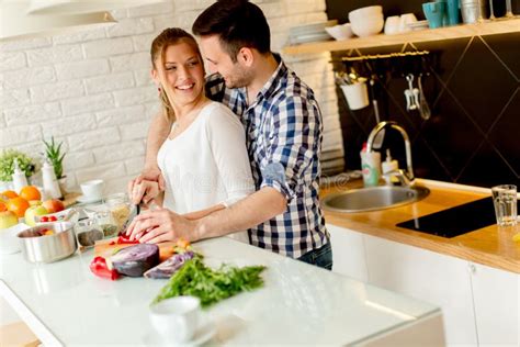 Young Couple Preparing Healthy Meal In The Kitchen Stock Image Image