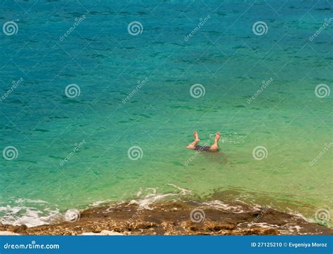 Legs Of A Man Jumping Into Sea Stock Photo Image Of Copyspace Ocean