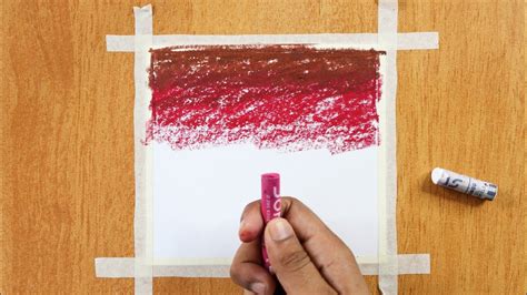 someone is holding a crayon marker in front of a piece of paper with ...