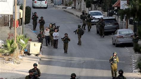 Israeli Army Raids Multiple Cities In West Bank Detains Tens Of Palestinians