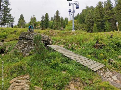 A bike park with small trails, jumps and hills in the alps Stock Photo ...