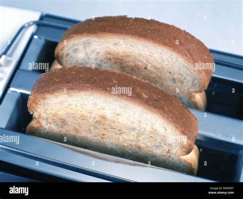 Toast, electric toaster Stock Photo - Alamy