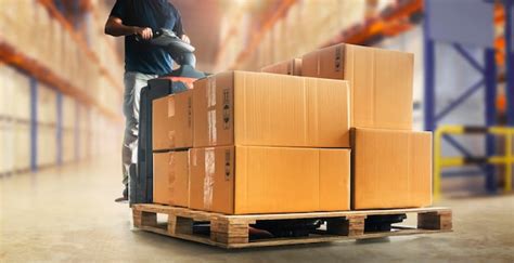 Premium Photo Workers Unloading Packaging Boxes On Pallet In The