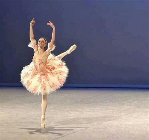 A Ballerina In A Pink Tutu And White Dress