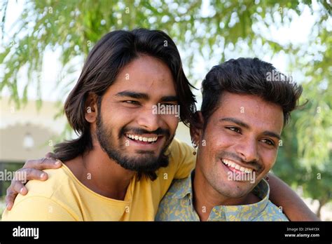 Portrait Of An Excited Indian Gay Couple Embracing And Smiling In A Park Stock Photo Alamy