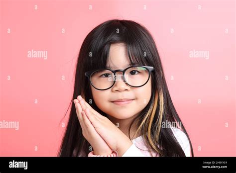 The Young Asian Girl Portrait On The Pink Background Stock Photo Alamy