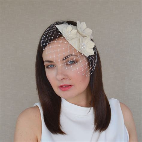 Veronika Off White Fascinator With Birdcage Veil Rubina Millinery