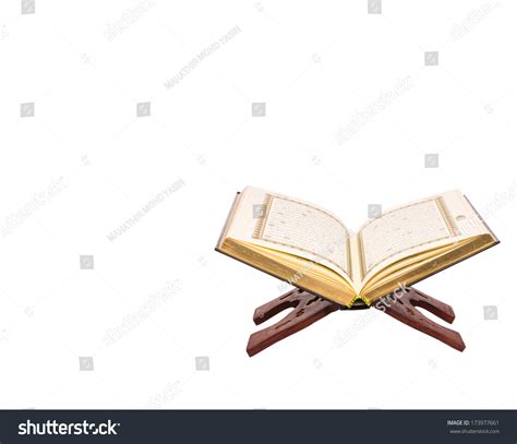 The Holy Quran On A Wooden Book Stand Over White Background Stock Photo