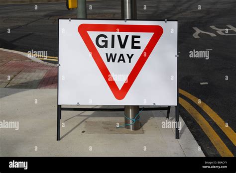 Give way road traffic sign Stock Photo - Alamy