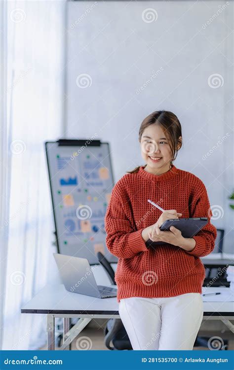 Young Woman Working On Laptop In Office Asian Female Accountant