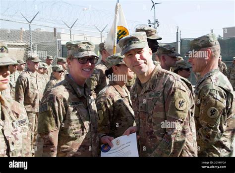 Brig Gen Howard Geck Commanding General Poses With Sgt Julie