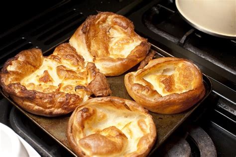 Premium Photo | Four freshly baked yorkshire puds