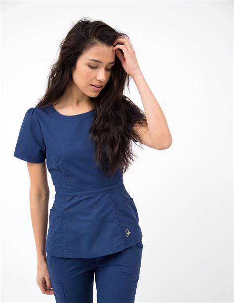 The Peplum Top In Estate Navy Blue Is A Contemporary Addition To Women