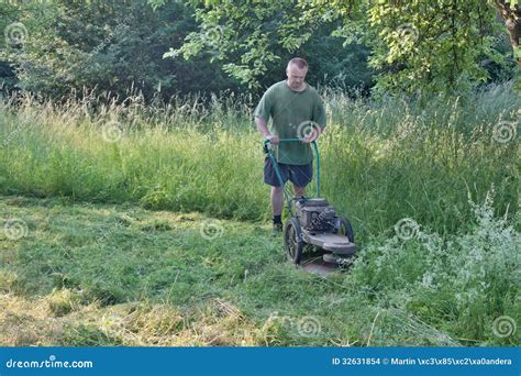 Man Mowing Tall Grass Stock Images Image 32631854