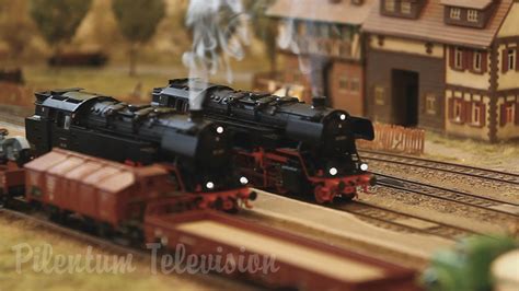 A pretty nice model railway in HO scale with smoking steam locomotives