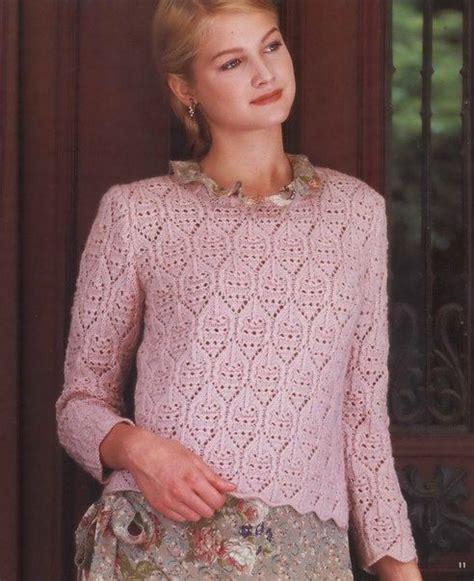 A Woman Wearing A Pink Sweater And Skirt