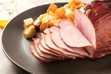 Premium Photo Traditional Sliced Honey Baked Ham On Plate Closeup