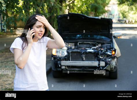 Driver Woman In Front Of Wrecked Car In Car Accident Scared Woman In