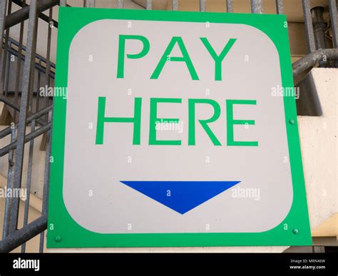 Closeup To A Pay Here Sign Stock Photo Alamy