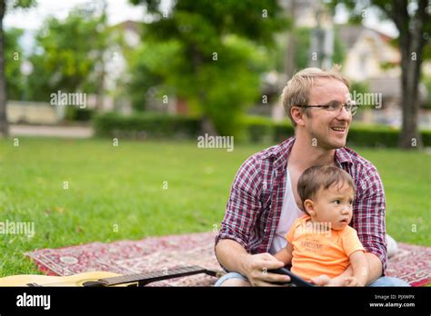 Happy Father And Baby Son Bonding Together Outdoors Stock Photo Alamy