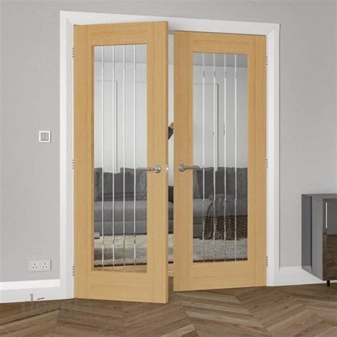 Deanta Ely Pre Finished Internal 1L Oak Door With Clear V Grooved Glass