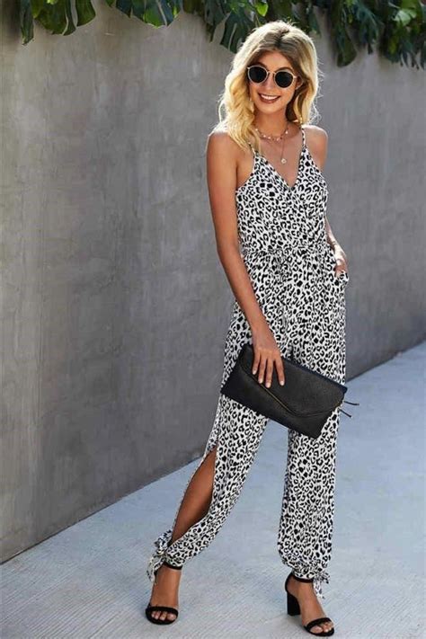 This leopard print surplice jumpsuit has slits on the sides of the calves and a delicate tie at ...