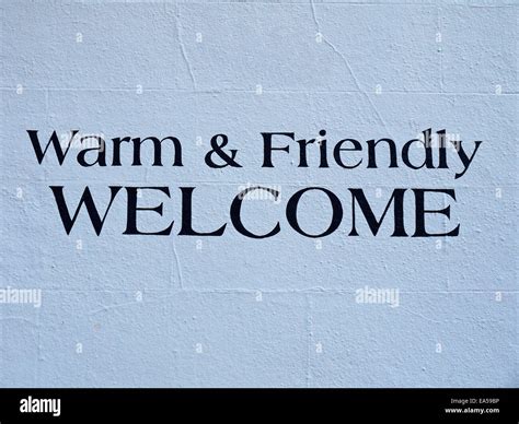warm friendly  sign painted   wall manchester uk