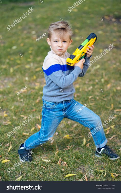 Boy Playing Park Toy Gun Stock Photo 1614137581 | Shutterstock