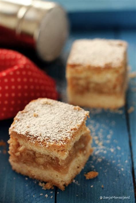 Two Pieces Of Cake Sitting On Top Of A Blue Table