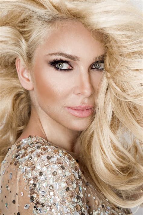 Beautiful Blonde Model With Amazing Eyes Wind Down Long Volume Hair With Highlights Stock Image