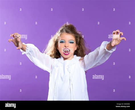 Children vampire makeup kid girl on purple background Stock Photo - Alamy