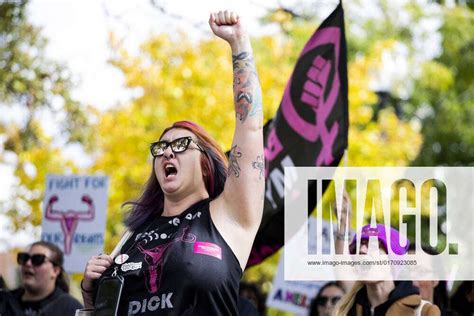 Womens Wave March 2022 A Demonstrator Holds Their Fist In The Air