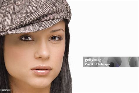 Portrait Of A Young Woman Wearing A Flat Cap High-Res Stock Photo ...