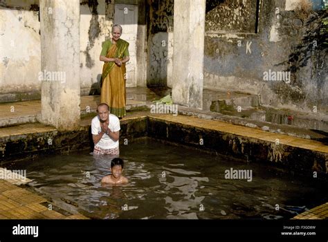 Old Couple Enjoying Holy Dip In Hot Spring Water At Ganeshpuri Near