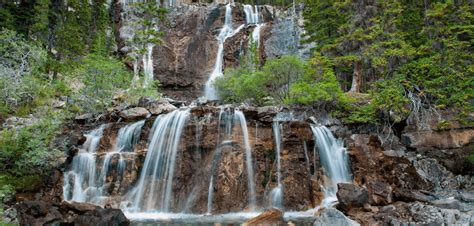 This magical tiered waterfall is right off an Alberta highway