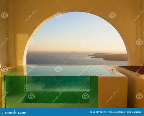 Infinity Pool with Stones at Sunset in Santorini Island, Greece Stock ...