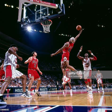 Dennis Rodman of the Chicago Bulls grabs the rebound against the... | Golf