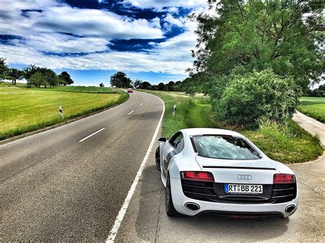 Free Photo White Audi Coupe On Gray Concrete Road During Textile