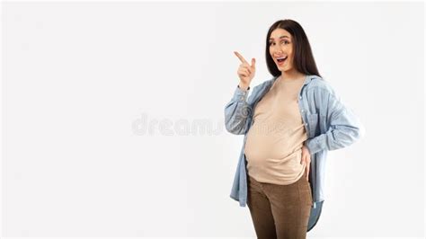 Pregnancy Advertisement Excited Pregnant Woman Pointing Aside At Copy