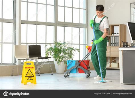 Male Janitor Mopping Floor Office Stock Photo By Serezniy 372033944