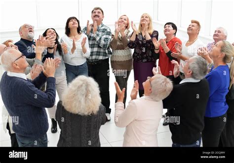 A Group Of Elderly People Clap Their Hands Stock Photo Alamy