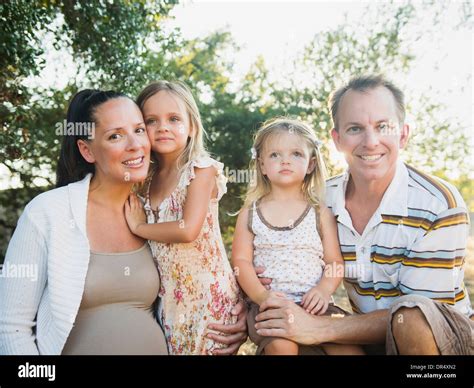 Family smiling together outdoors Stock Photo - Alamy