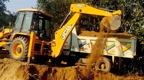 Jcb Backhoe Machine Loading Soil In Heavy Dump Truck Full Loading