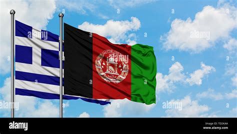 Greece And Afghanistan Flag Waving In The Wind Against White Cloudy