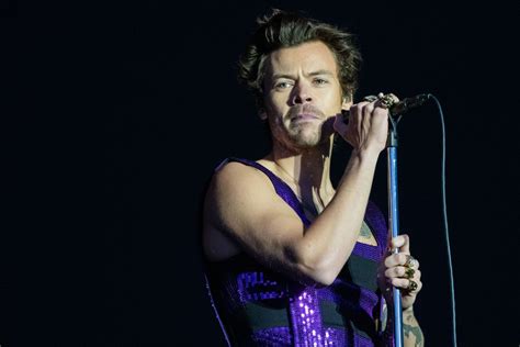 Watch Harry Styles Get Hit In The Eye With Flying Object During Concert