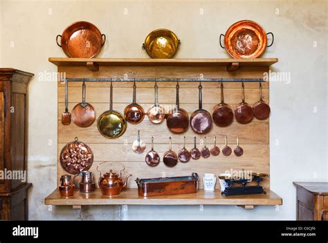 Copper pots and pans in a kitchen Stock Photo - Alamy