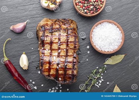 Grilled steak with spices stock photo. Image of fillet - 165445700